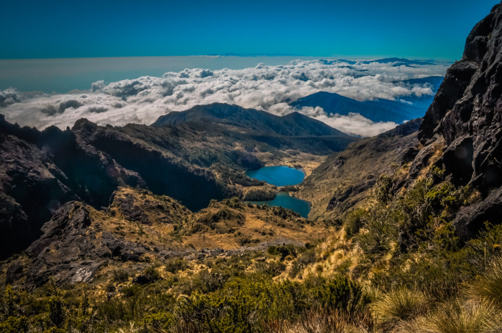 Lake and mountains covered by morning fog on Mount Wilhelm, Papua New Guinea