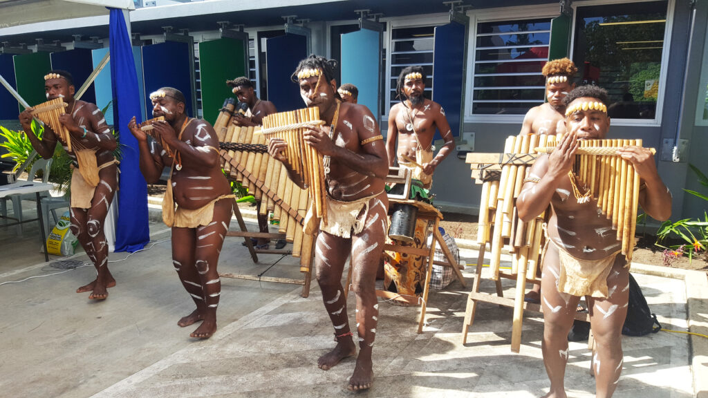 Local Solomon Islanders performing using tradition musical instruments, Honiara, Solomon Island
